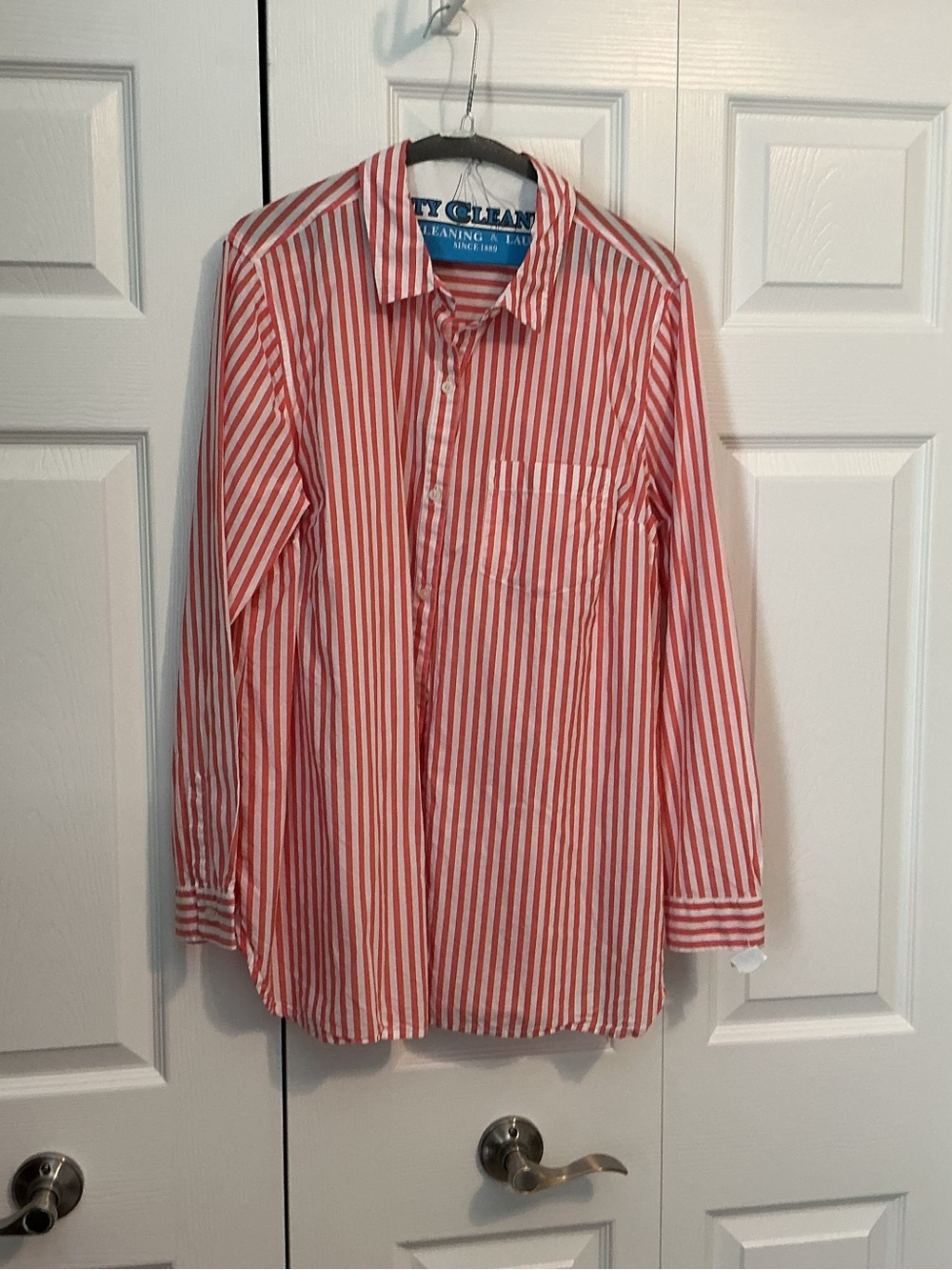 Woman’s orange and white stripe blouse